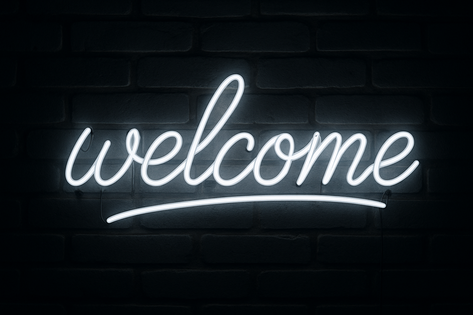 glowing white neon sign reads welcome
